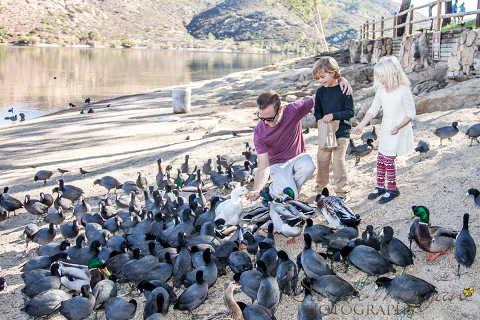 Perkins family feeding ducks at Lake Poway